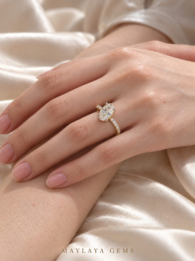 Maylaya Gems M083A oval diamond ring in yellow gold worn naturally on a female model hand