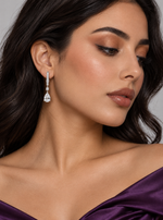 Load image into Gallery viewer, Maylaya Gems 9K Gold 1 ct Pear Diamond Drop Earrings — MGE8 — AI-generated young adult model in eveningwear / ภาพจำลองนางแบบสวมเครื่องประดับด้วย AI