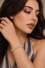 Load image into Gallery viewer, Maylaya Gems 15.48 ct Oval, Pear & Emerald Tennis Lab-Grown Diamond Bracelet — AI-generated young adult model in eveningwear / ภาพจำลองนางแบบสวมเครื่องประดับด้วย AI