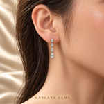 Load image into Gallery viewer, Maylaya Gems MGE10 on-ear view — ChatGPT-rendered illustration with approximate carat-to-millimetre wearing scale; actual fit varies.
