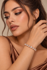 Load image into Gallery viewer, Maylaya Gems 6.82 ct Cushion Alternating Tennis Lab-Grown Diamond Bracelet — AI-generated young adult model in eveningwear / ภาพจำลองนางแบบสวมเครื่องประดับด้วย AI
